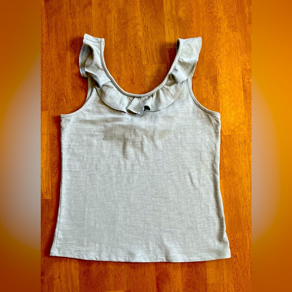 Women’s small tank top with ruffles, pre-owned, good quality.